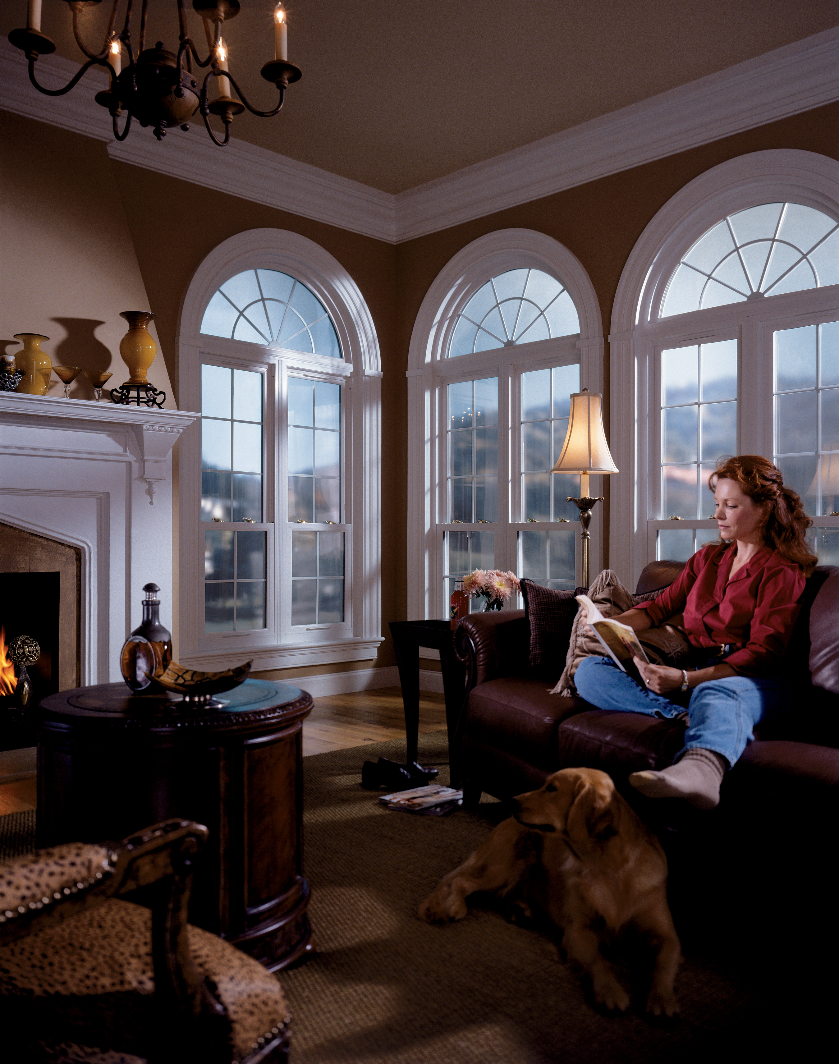 Woman reading with arch windows hi-res